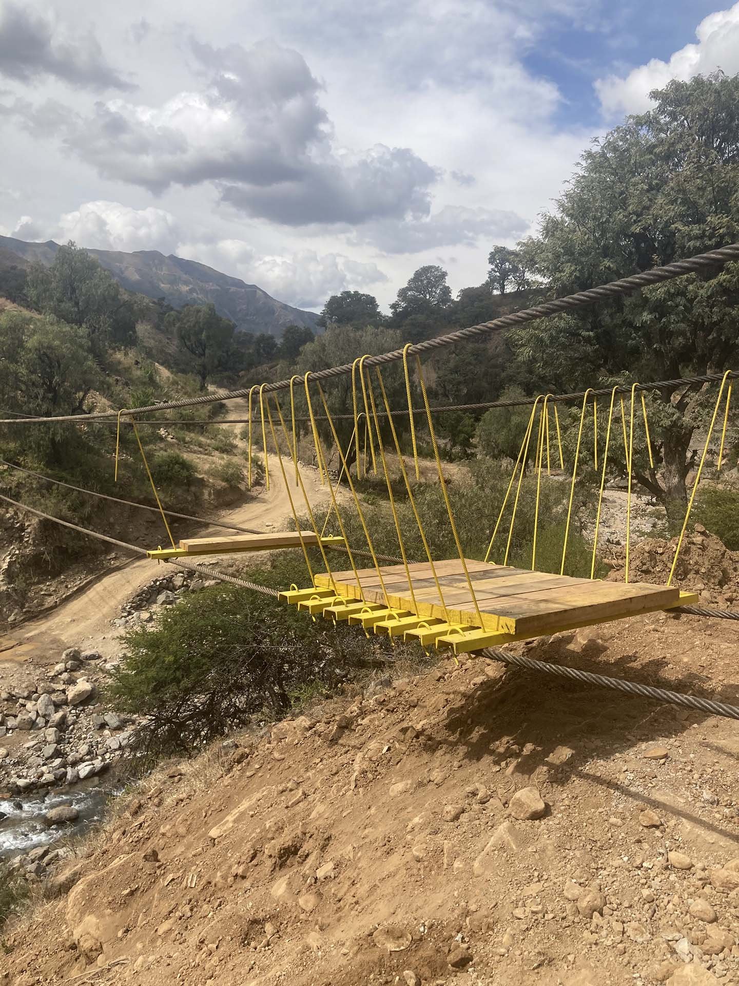 Bolivia Suspended Bridge Laying Planks
